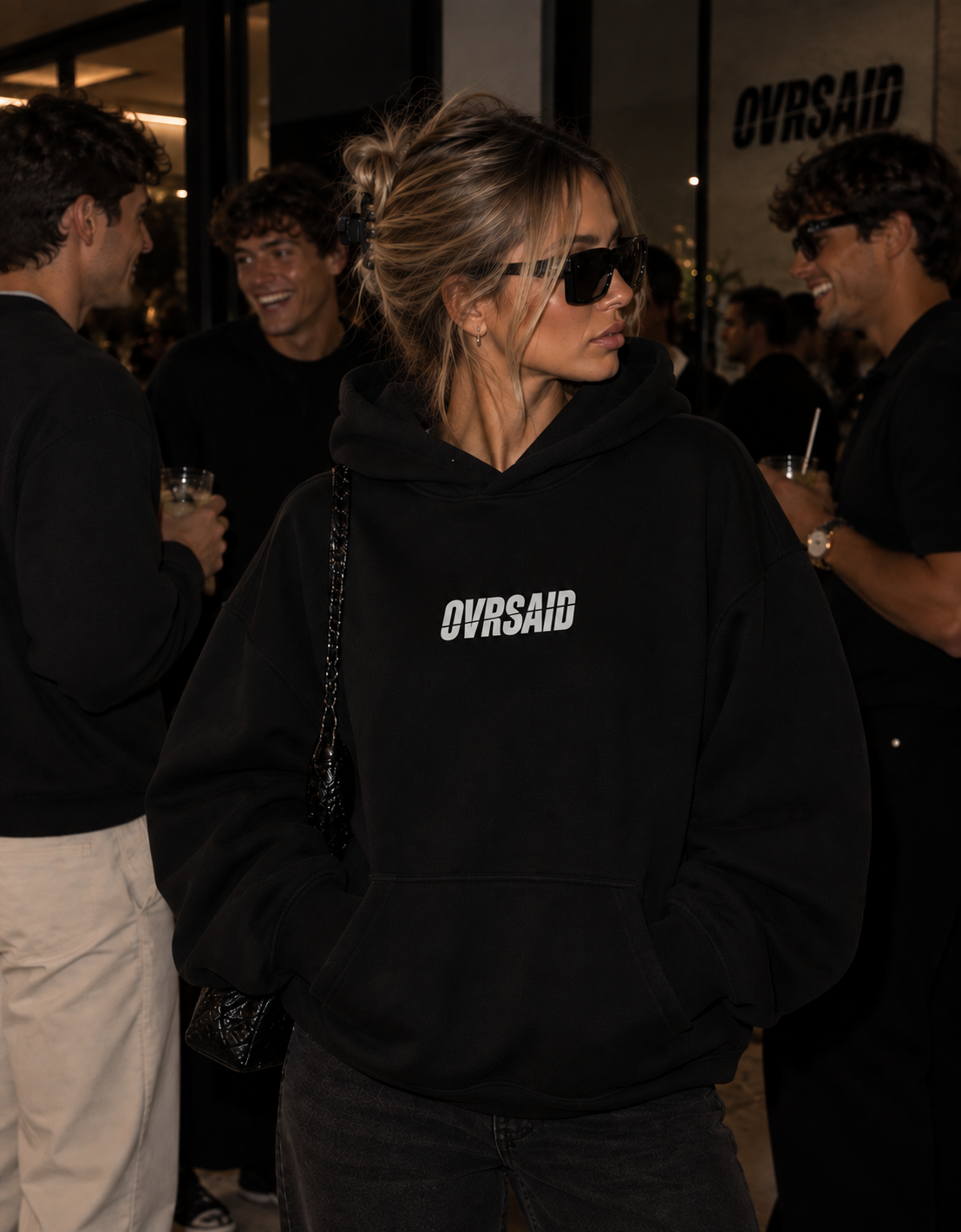 Color Black — OVRSAID IF YOU NEED A PROBLEM, I'M HERE. oversized hoodie on female model, front view with small OVRSAID chest mark