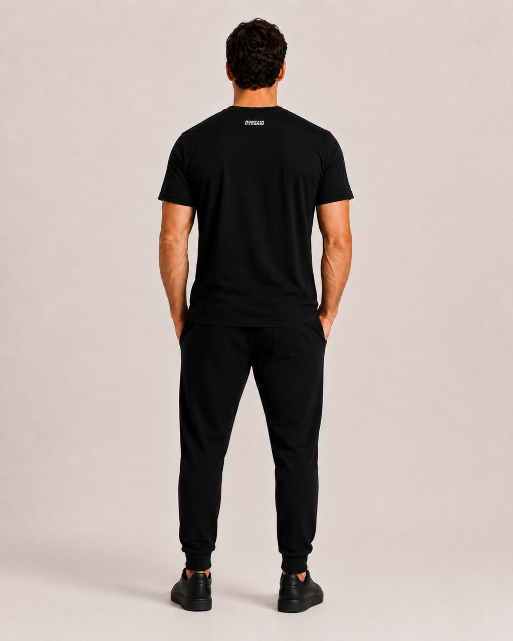 OVRSAID black statement tee, back view with small OVRSAID neck logo