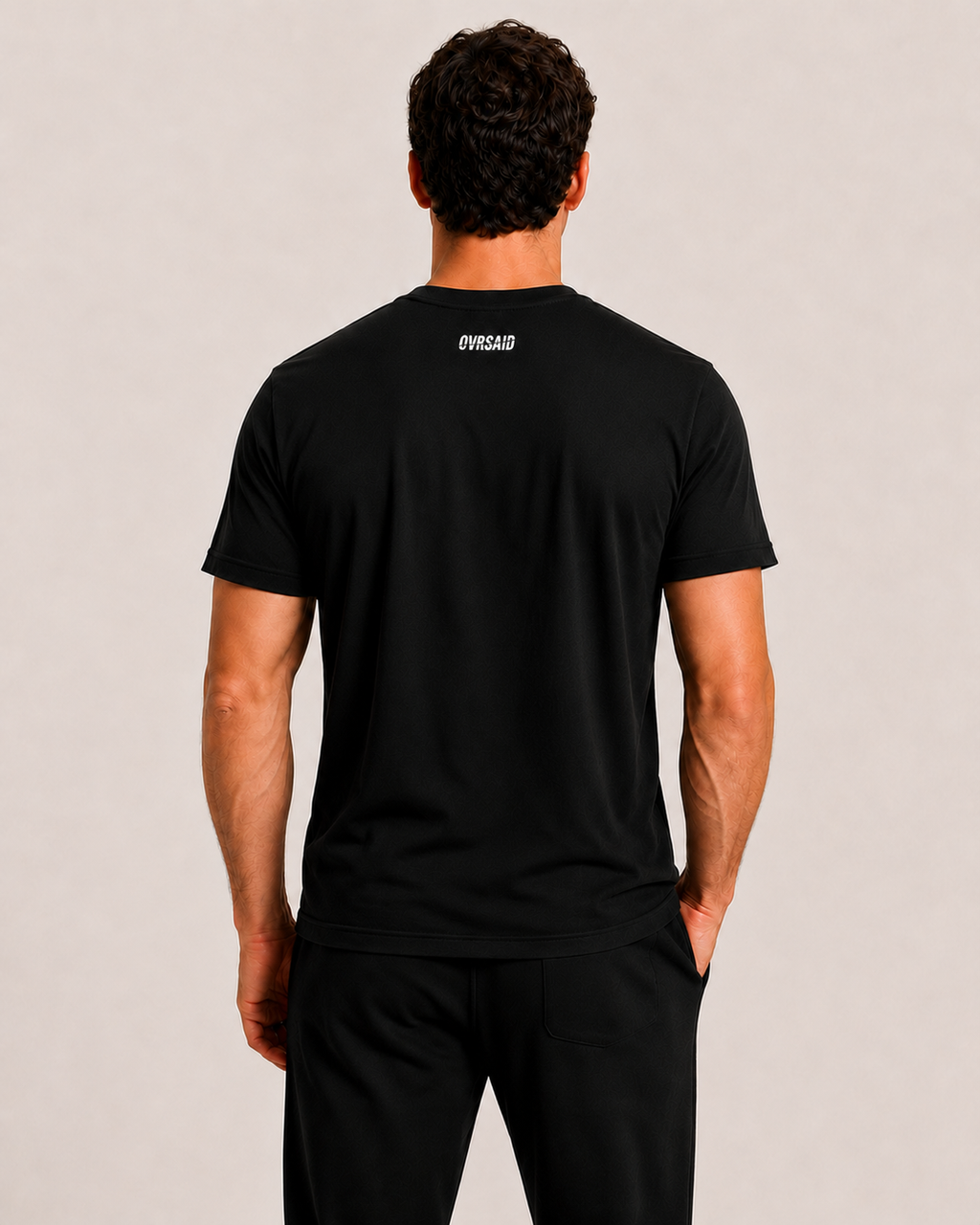 Back view of OVRSAID black statement tee with small OVRSAID neck logo