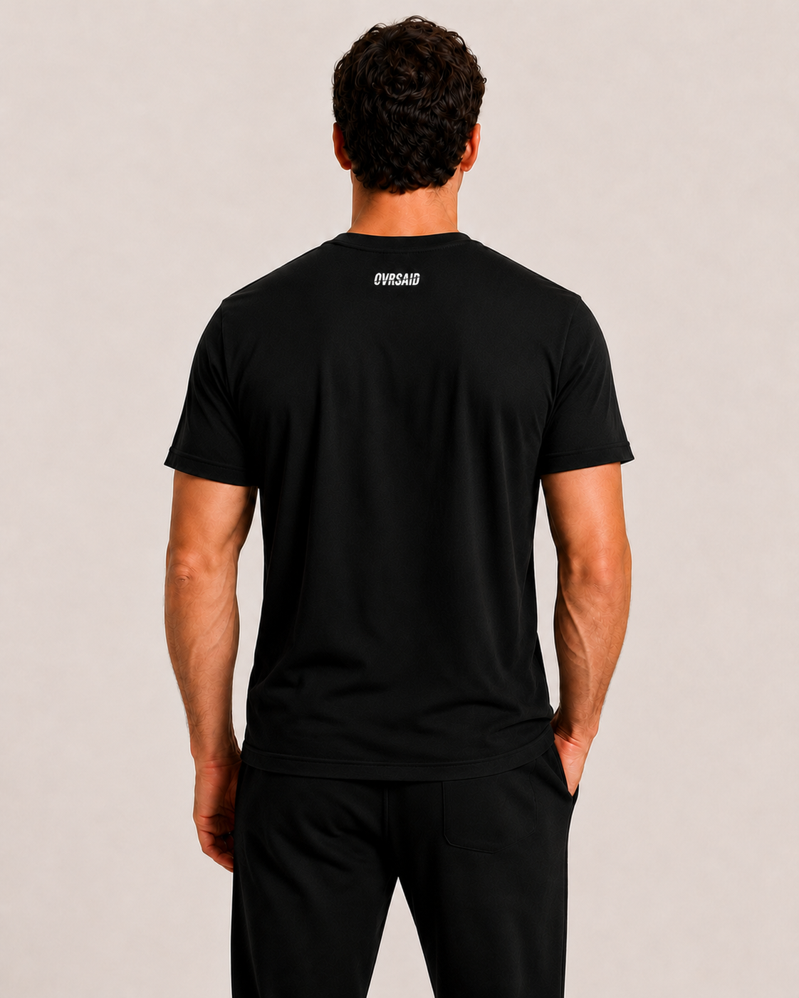 Back view of OVRSAID black statement tee with small OVRSAID neck logo