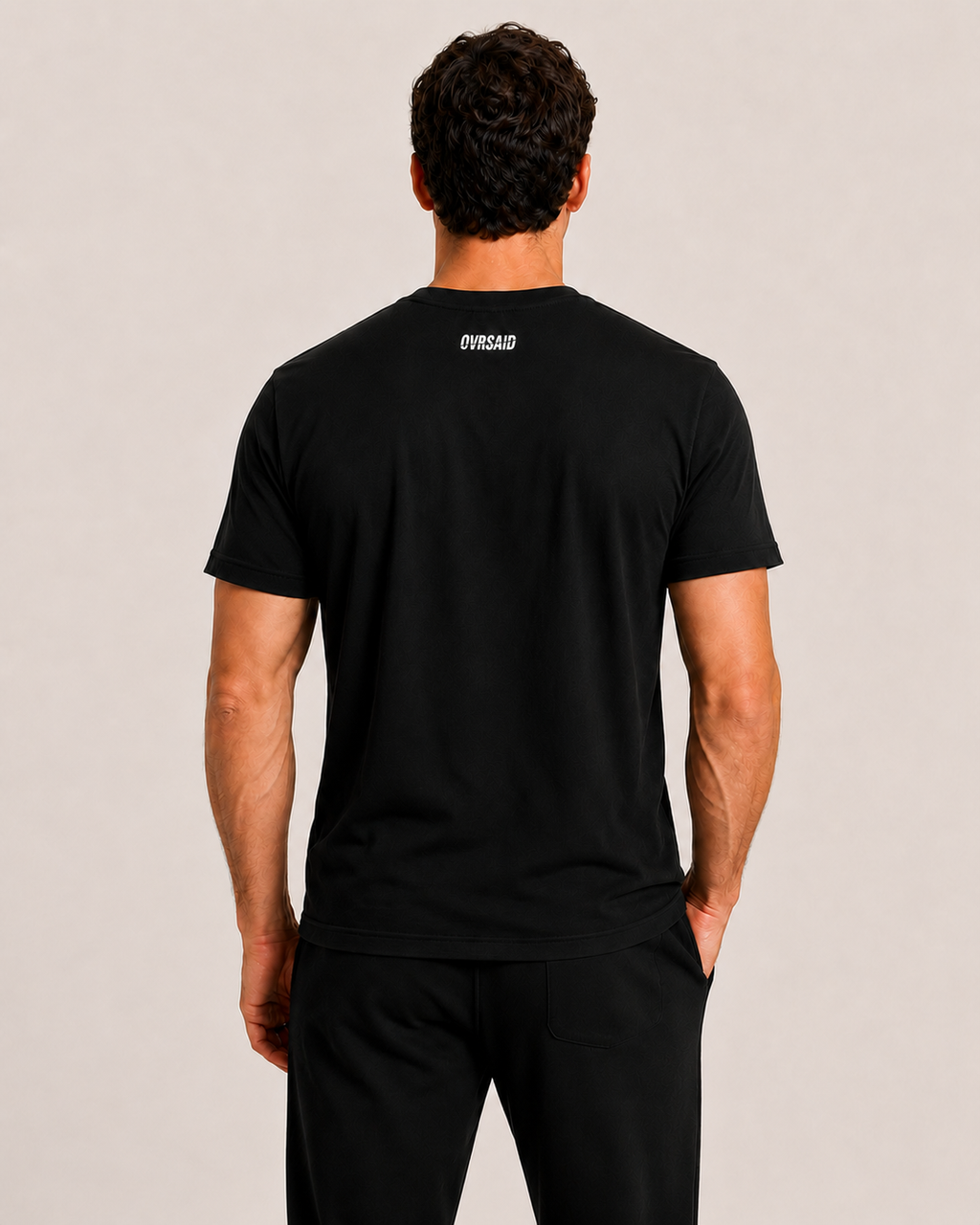 Back view of OVRSAID black statement tee with small OVRSAID neck logo