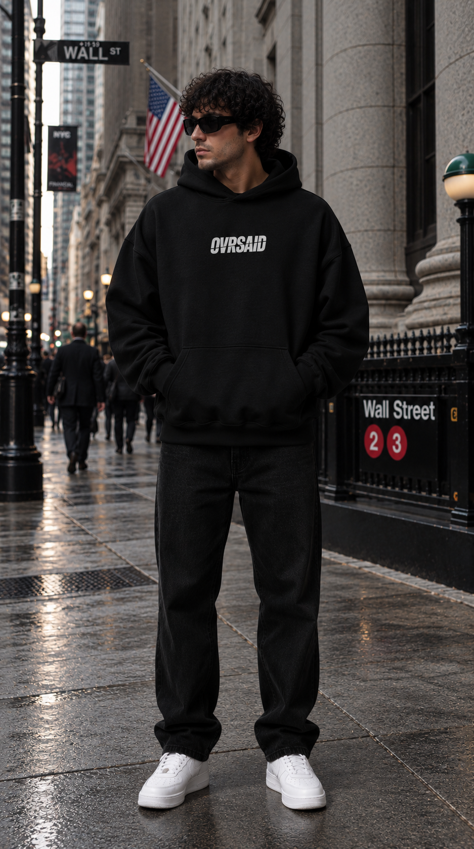 Color Black — OVRSAID I DON'T NEED THERAPY. I NEED LIQUIDITY. oversized hoodie on male model, front view with small OVRSAID chest mark