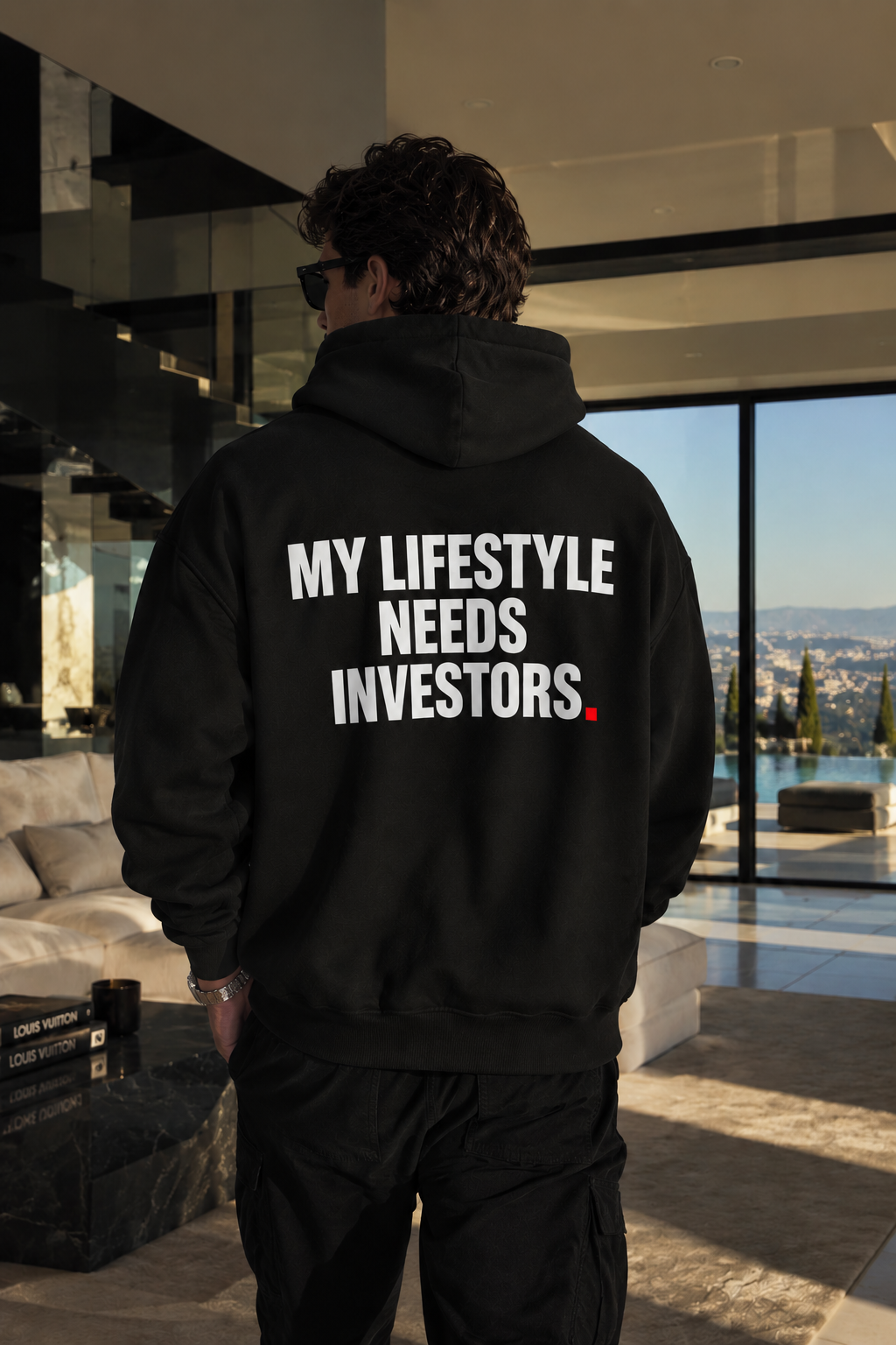 Color Black — OVRSAID MY LIFESTYLE NEEDS INVESTORS. oversized hoodie on male model, back view showing the white back print
