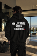Color Black — OVRSAID MY LIFESTYLE NEEDS INVESTORS. oversized hoodie on male model, back view showing the white back print