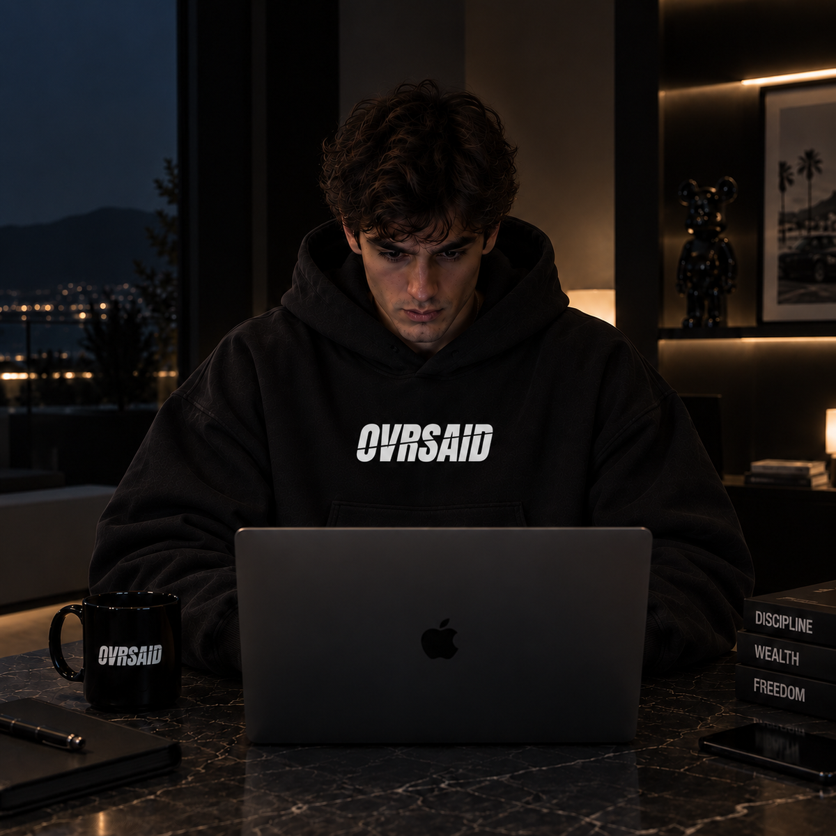 Color Black — OVRSAID I MAKE CHATGPT LOOK LIKE AN INTERN. oversized hoodie on male model, front view with small OVRSAID chest mark