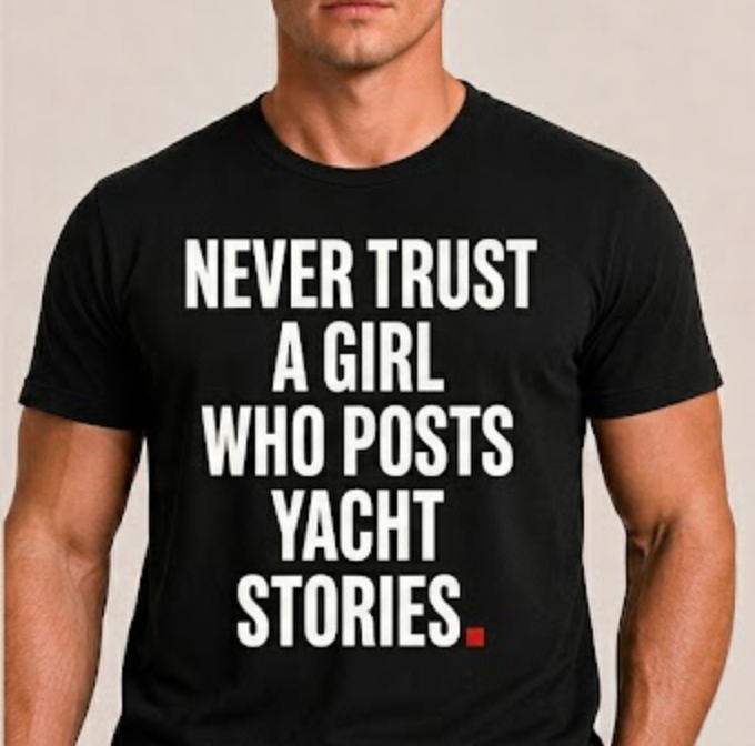 Close-up of OVRSAID NEVER TRUST A GIRL WHO POSTS YACHT STORIES front print on black statement tee