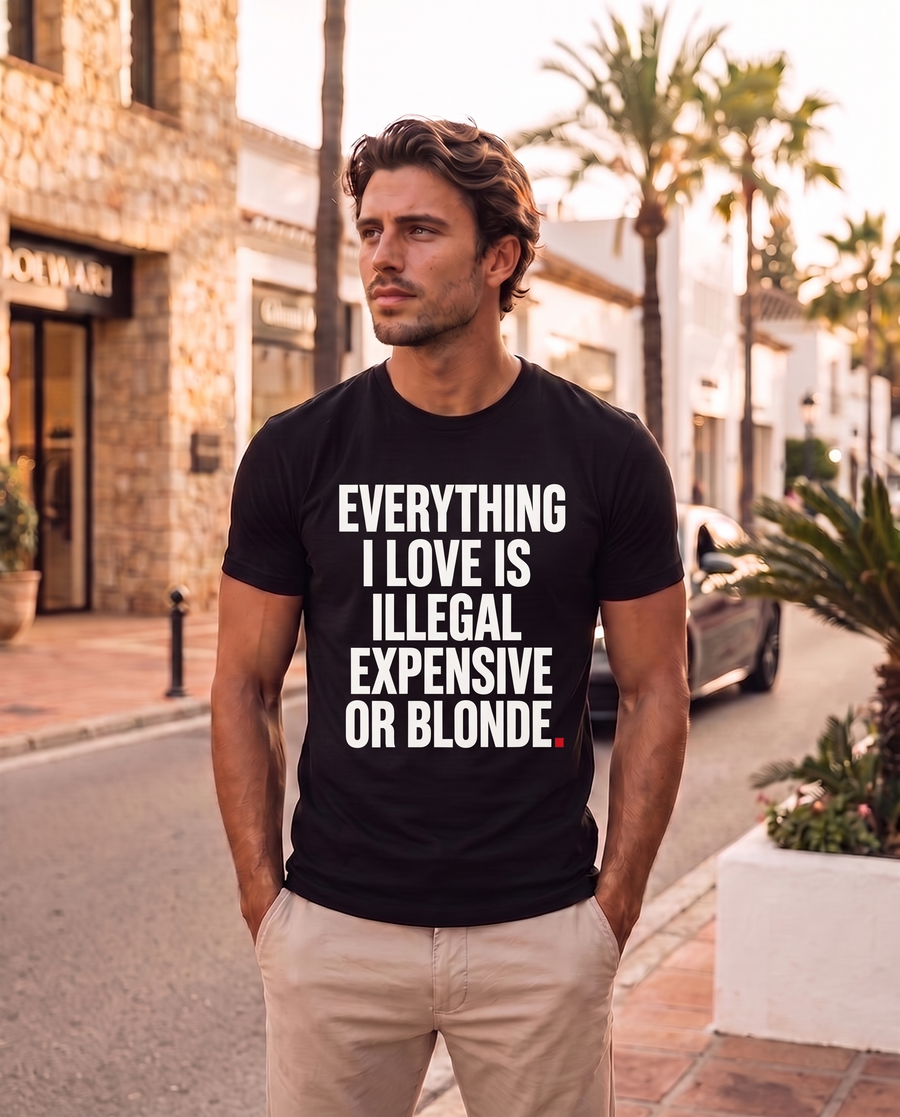 Color Black — OVRSAID EVERYTHING I LOVE IS ILLEGAL EXPENSIVE OR BLONDE regular slim-fit tee on male model, front view